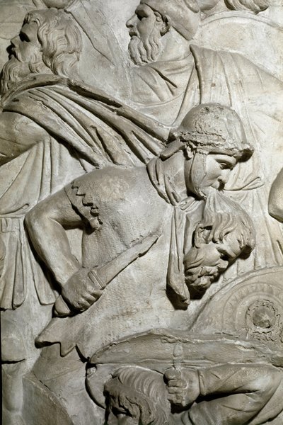 Roma sanatı: “” Dişlerinin arasında bir düşman savaşçının başını tutan Romalı savaşçı”” İmparator Trajan döneminde Roma