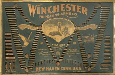 Genişletilmiş bir "W" şeklinde düzenlenmiş kapsamlı bir metalik, pirinç ve kağıt kasalı tüfek ve atış kartuşu seçimine sahip bir Winchester Cartridge ekran kartı by Unbekannt