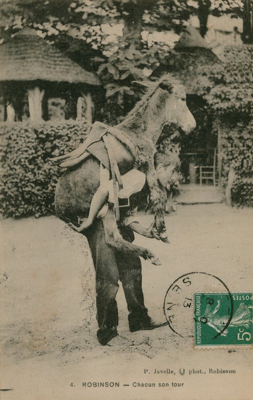 1913 yılında gönderilen bir eşek taşıyan bir adamın kartpostal by French Photographer